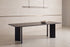The Pesaro Stone Dining Table in a dining room setting