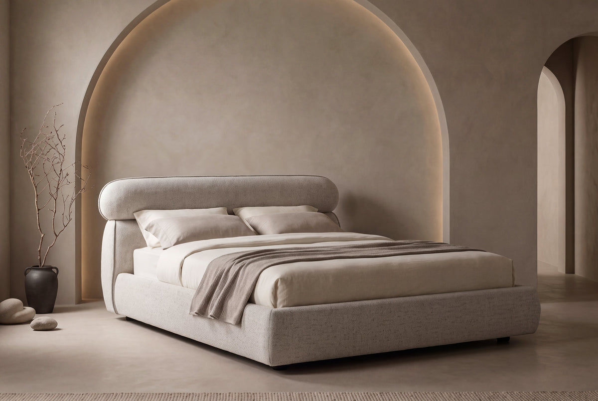 The Positano Bed in oatmeal textured weave in an arched plaster bedroom