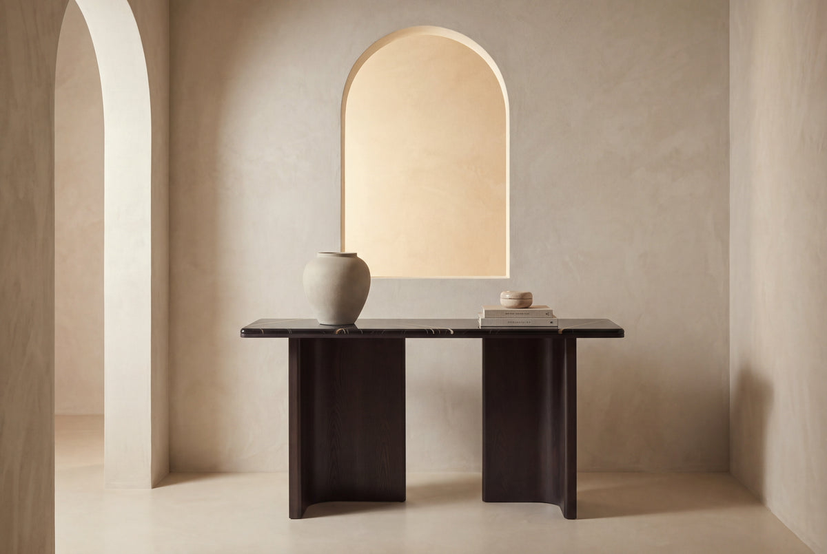 The Sestri Marble Console Table in an arched plaster entrance hall