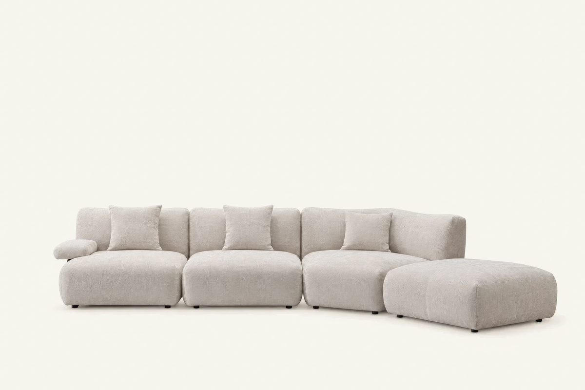 The Solaro Modular Sofa in oatmeal chenille with matching cushions, three seats with ottoman, front view