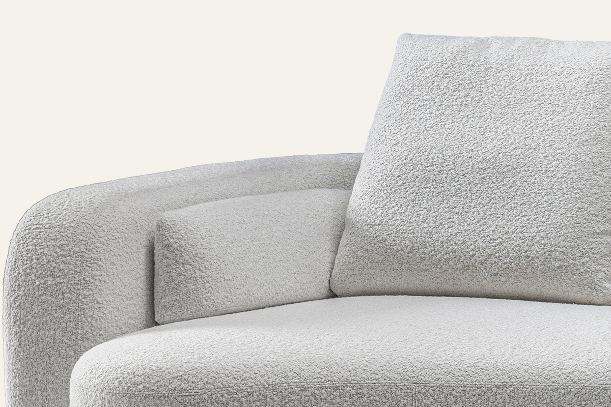 The Sorella Chaise Sofa, close-up of the white bouclé arm and cushion