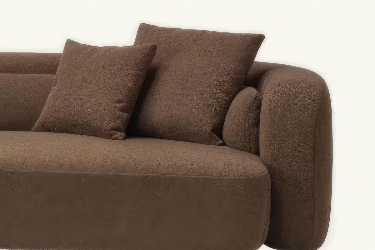 The Sorella Sofa, close-up of the chocolate-brown bouclé arm and cushions
