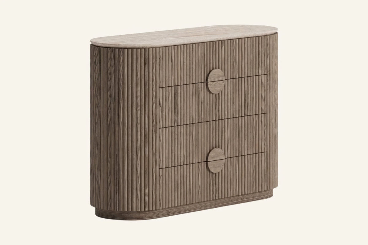 The Spello Fluted Travertine Chest of Drawers, angled view