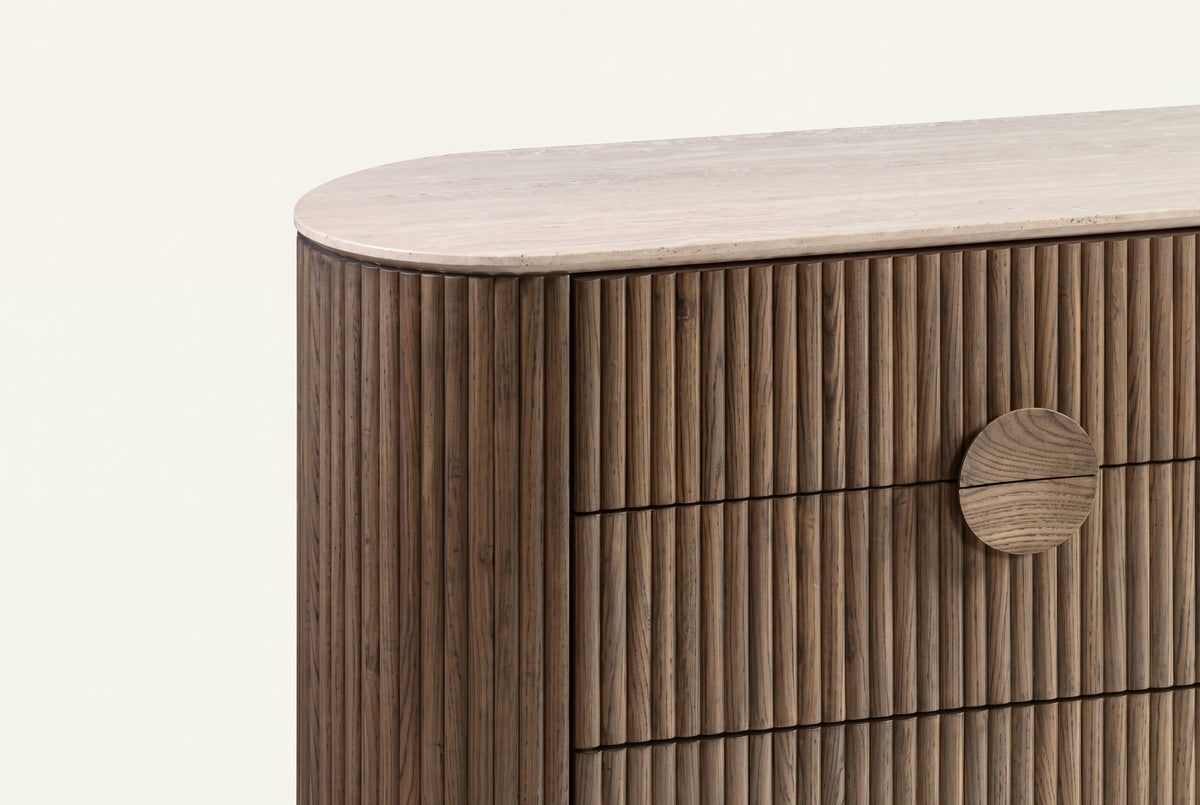 The Spello Fluted Travertine Wide Chest of Drawers, fluting and travertine top detail