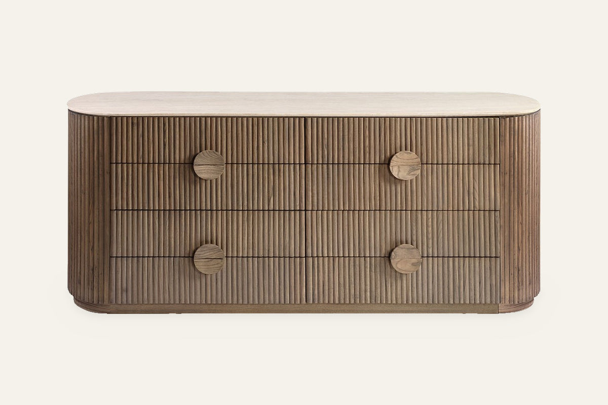 The Spello Fluted Travertine Wide Chest of Drawers, front view