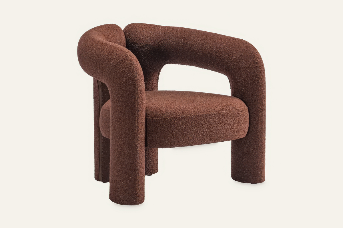 The Terracina Accent Chair in rust bouclé, angled view
