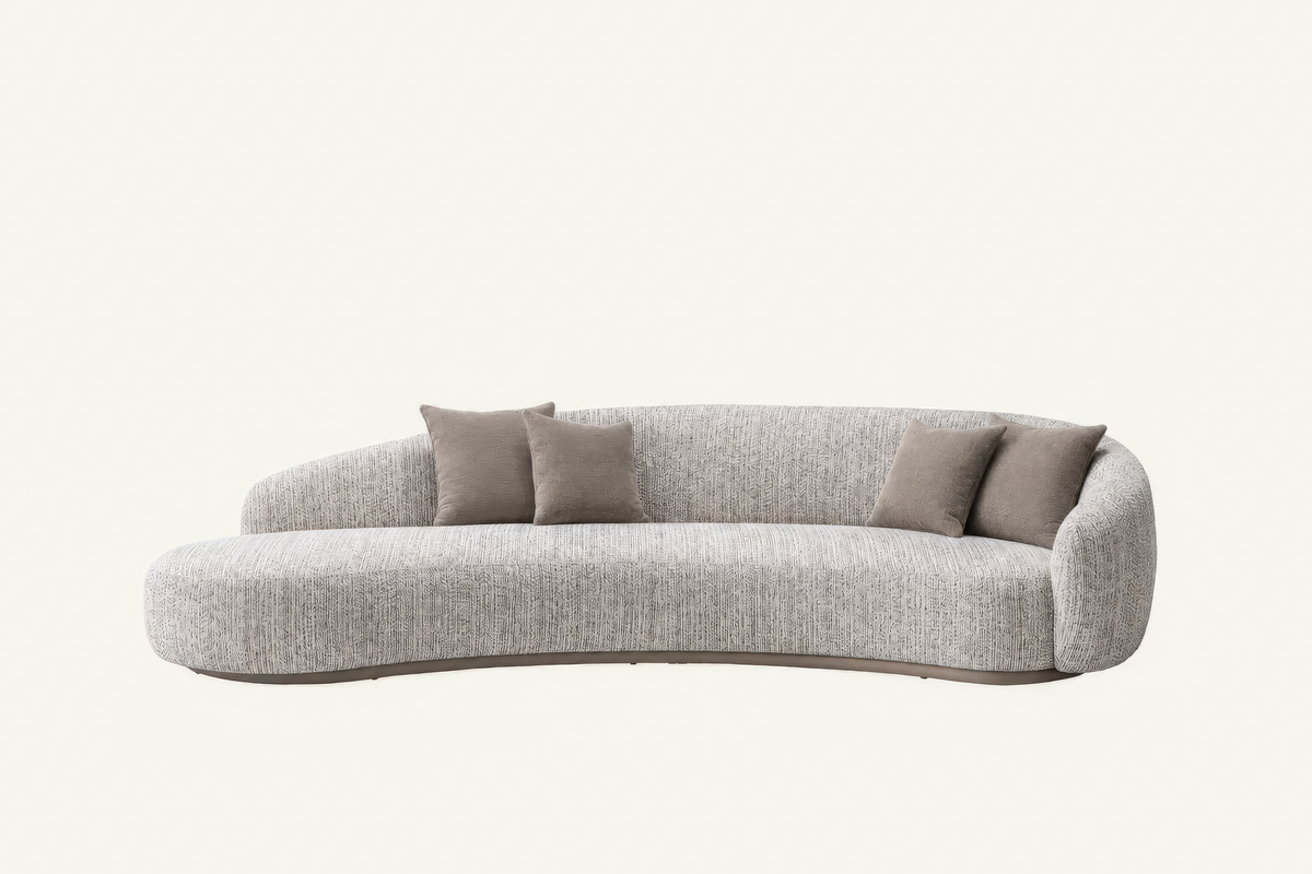 The Varenna Sofa in grey chenille with a leather base band, studio view