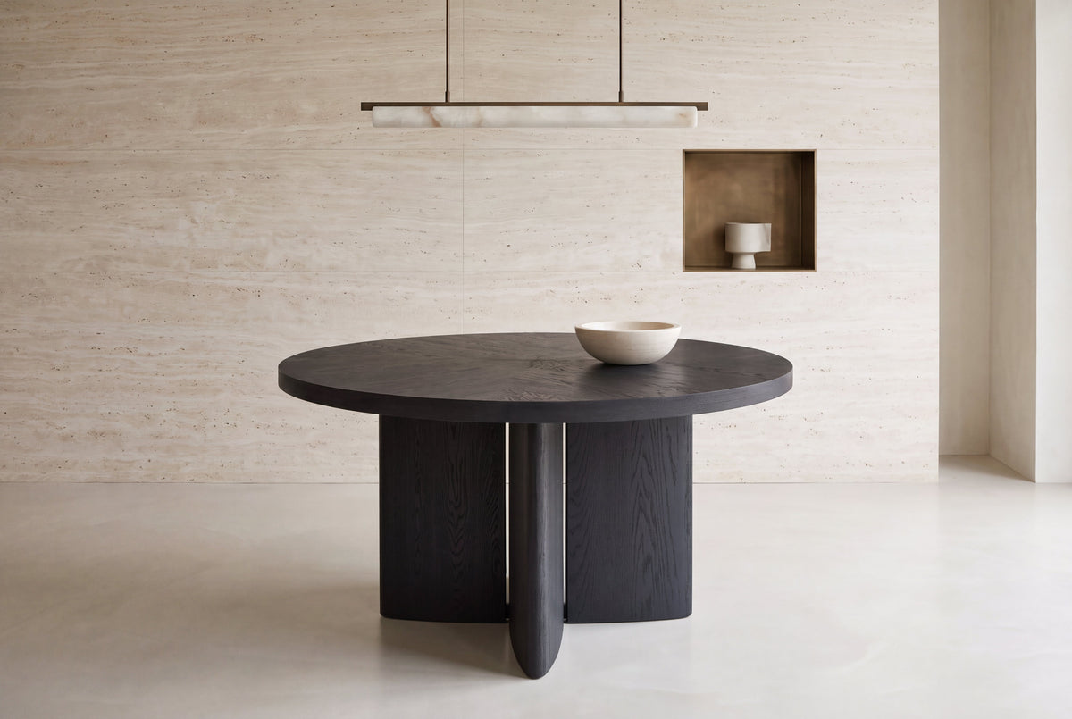 The Vinci Black Oak Round Dining Table in a dining room setting