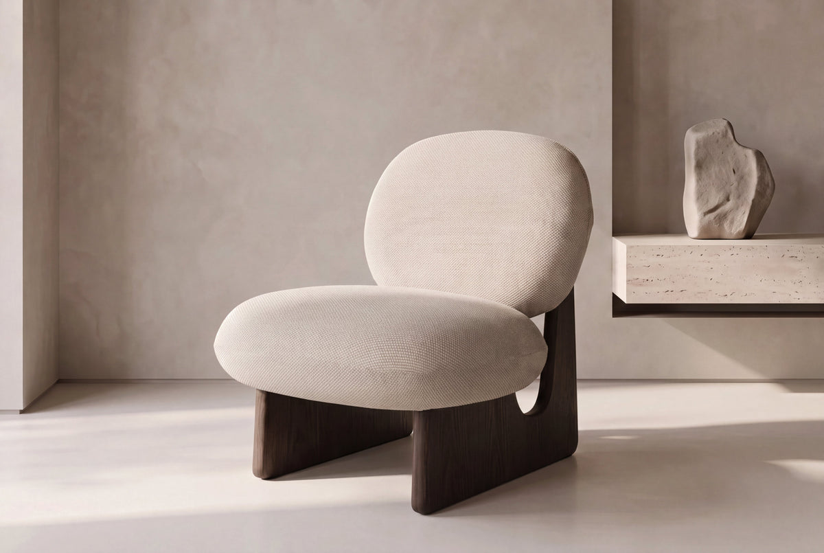 The Volterra Lounge Chair at an angle in a calm plaster living space