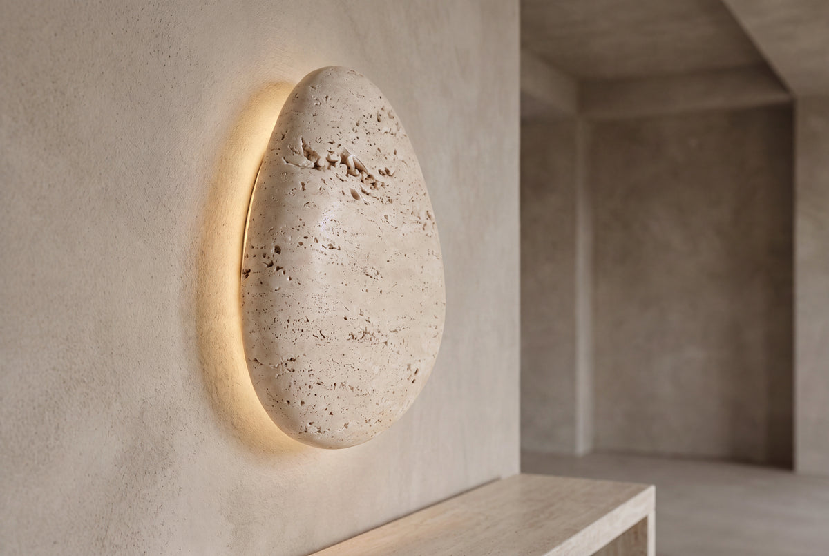 The Uovo Travertine Wall Light, lifestyle close-up