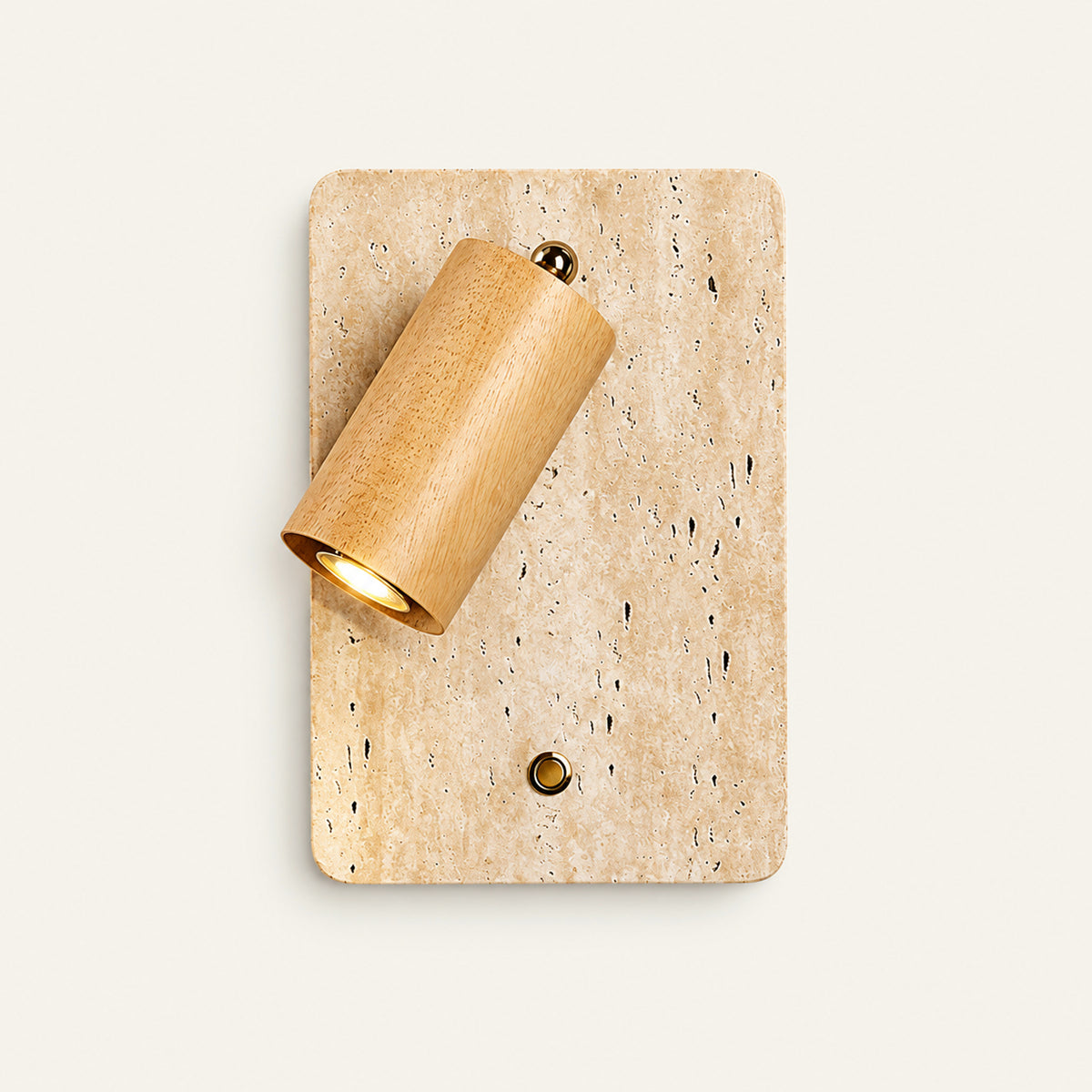 The Vassoio travertine wall light with a natural oak spotlight