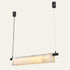 The Vela alabaster linear pendant light, a curved stone panel with black end caps