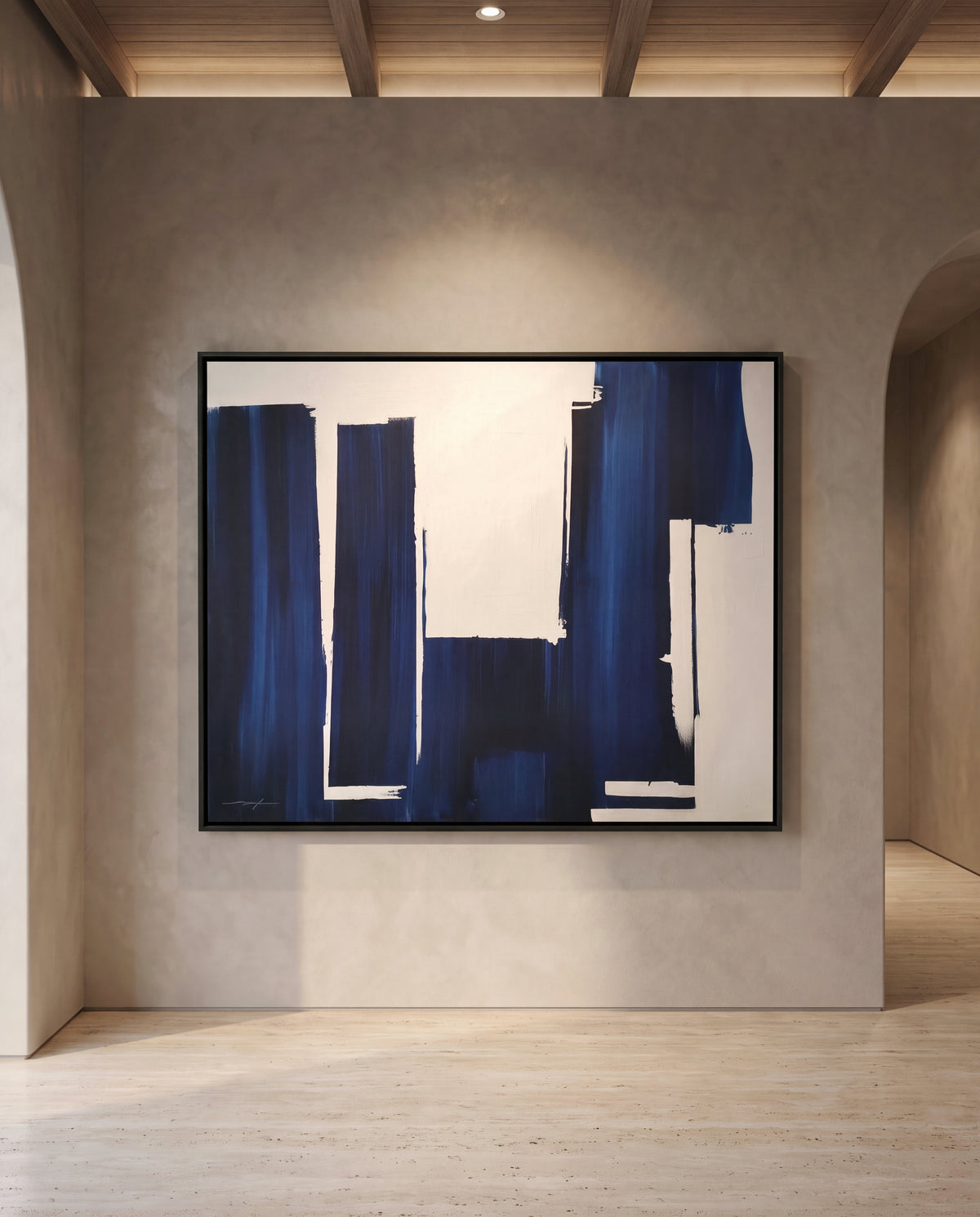Velonne canvas artwork in a black frame on a plaster wall